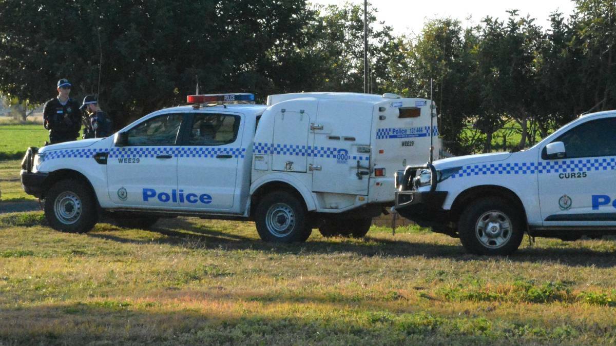 Case adjourned: Police combed the scene of the alleged murder in Gunnedah last year. Photo: Jessica Worboys