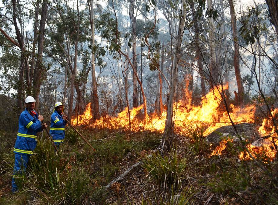 TRIED AND TRUE: A 2017 cultural burn near Guyra conducted by Banbai Indigenous rangers and the Guyra Rural Fire Brigade. Photo: file