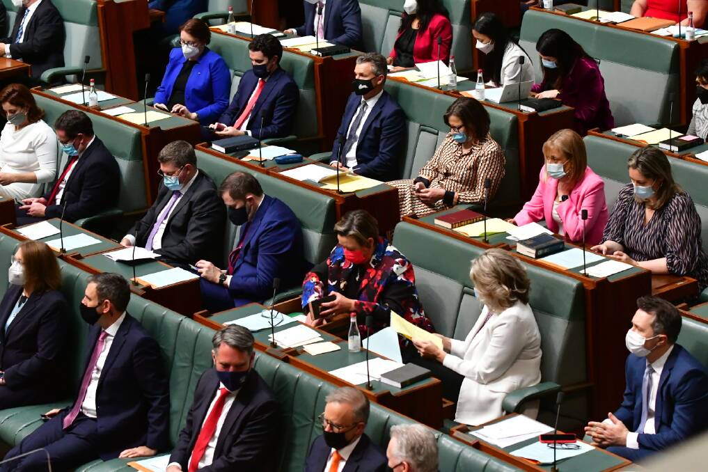 Labor MPs all masked up on the first sitting day. Picture: Elesa Kurtz