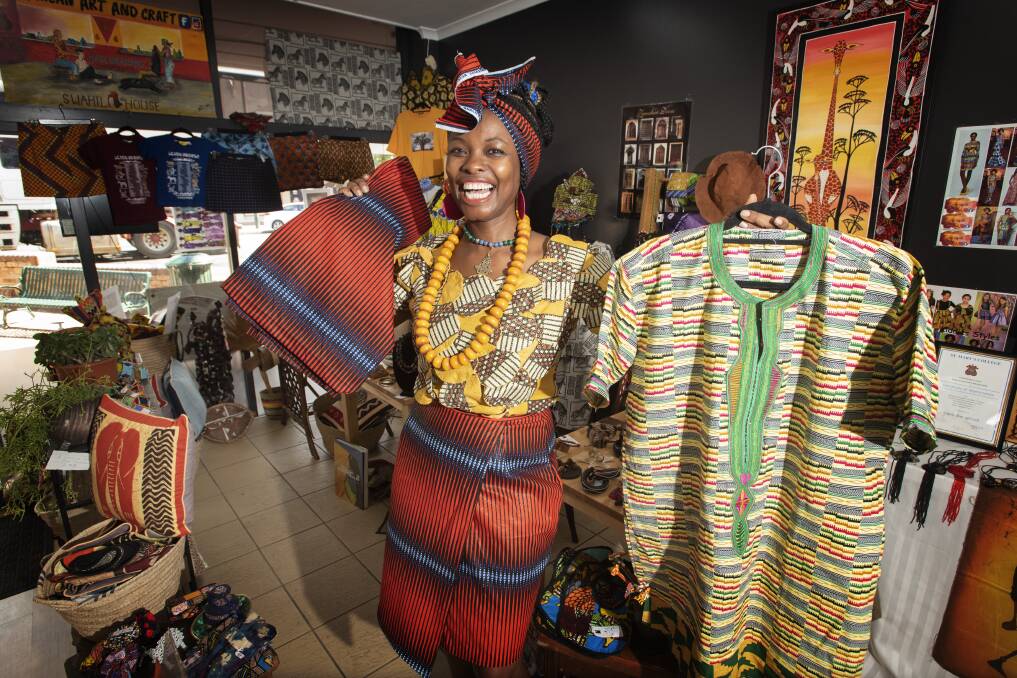 WELCOMING SMILE: The store is filled with different fabrics and textiles with items made from ebony, rafia, mud cloth and Masai beads work. Photo: Peter Hardin