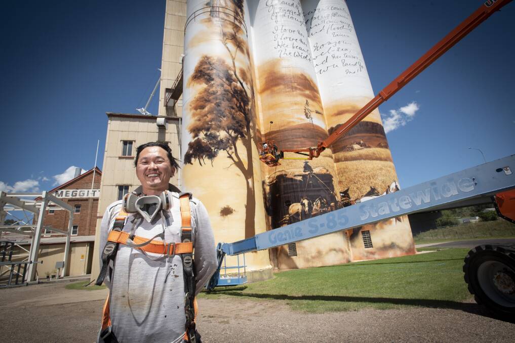 COMPLETE: Melbourne artist Heesco has put the finishing touches on the Gunnedah Maize Mill mural featuring Dorothea Mackellar. Photo: Peter Hardin