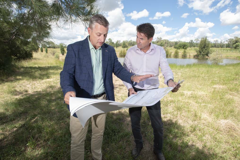 CHANGING COURSE: Jamie Chaffey and Kevin Anderson looking at the plans for the much talked about Gunnedah Koala Sanctuary. Photo: Peter Hardin/ File