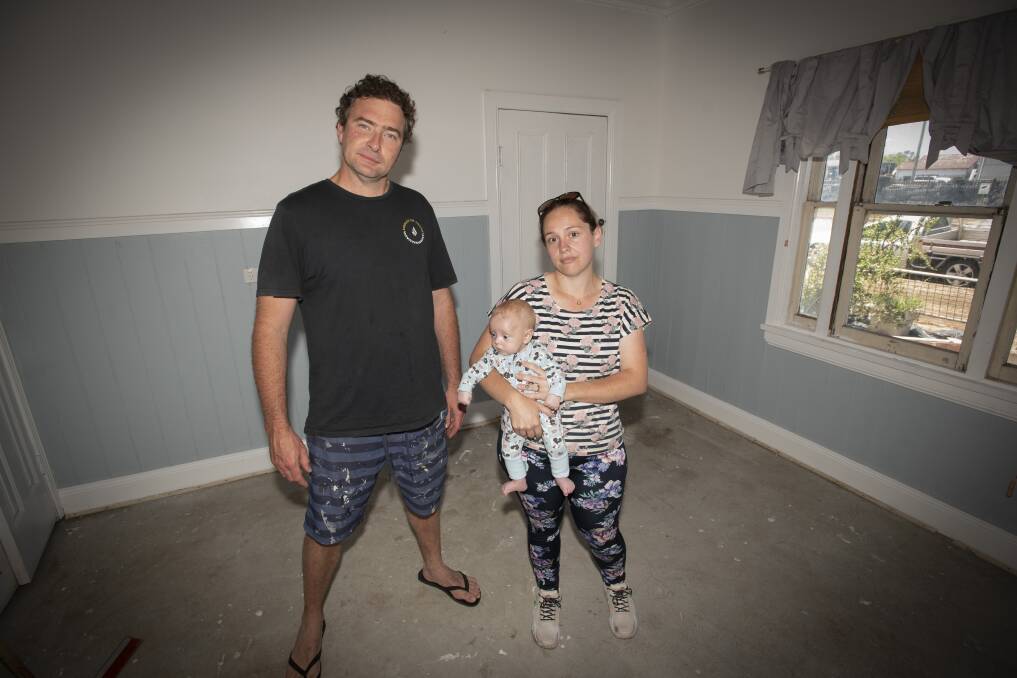 IMPACTED: Gunnedah locals Dion Betts and Katrina Logan (pictured with baby Archer) have both been badly impacted by the floods. Photo: Peter Hardin