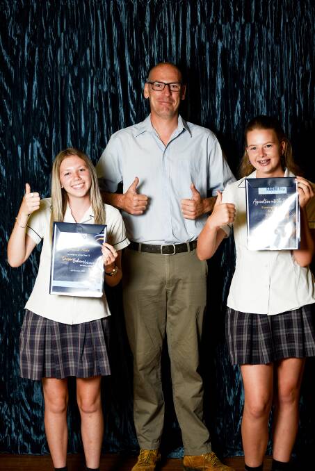 THUMBS UP: 2021 Farming for Kids scholarship winners Indiah Nean (left) and Hayley Morris (right) with their Year Adviser. Photo: Supplied 