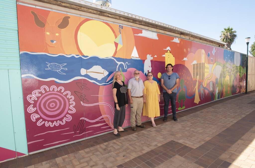 ALLEYWAY ART: Louise Hill, Dan Birkett, Marie Low and Alex Bayliss from Arts Gunnedah in front of the new mural on Wednesday. Photo: Peter Hardin