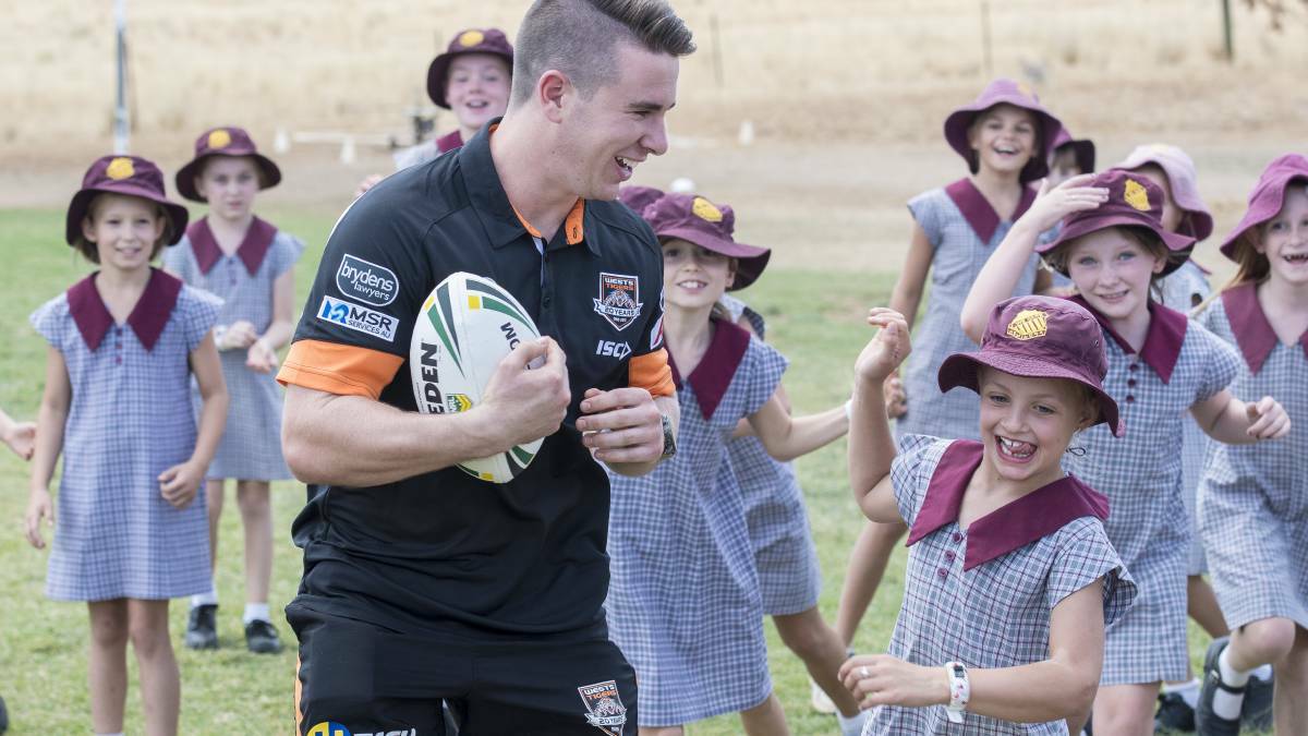 Wests Tigers young gun Jock Madden at a free clinic at Nemingha Public School in 2019. Photo: Peter Hardin