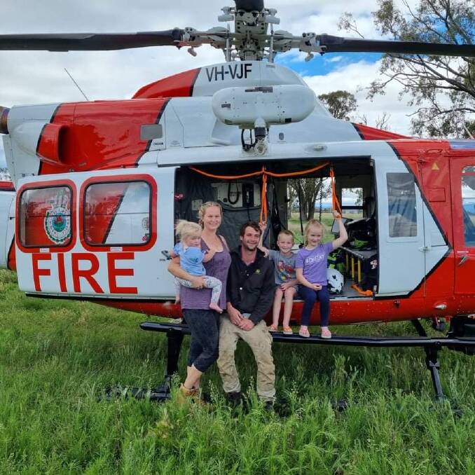 FOOD DELIVERY: Courtney and Luke Evans and kids Alice, Emmett and Kate received a much-needed food delivery from RFS aircrew members to their property outside of Gunendah on Sunday. Photo: Supplied