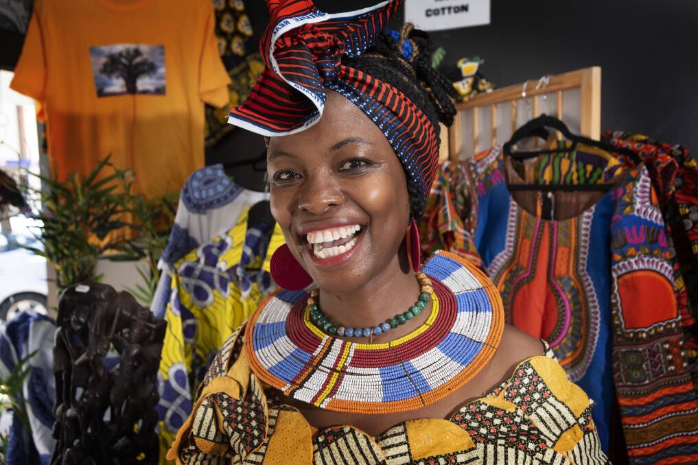 BOLD COLOURS: Anjela Kyungai's store is a sea of bold colours and she adorns herself daily with many of the items that are for sale. Photo: Peter Hardin