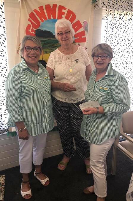 HAPPY HANDOVER: GCA president Kate Knight and secretary Linda Lee being presented with a cheque from GGC president Fay Byrne. Photo: supplied.