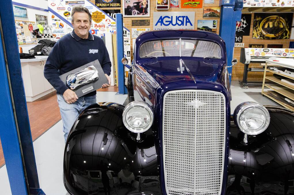 Peter Fitzpatrick with his award and the extraordinary 1935 Chevrolet three-window coupe. Picture: Jamila Toderas