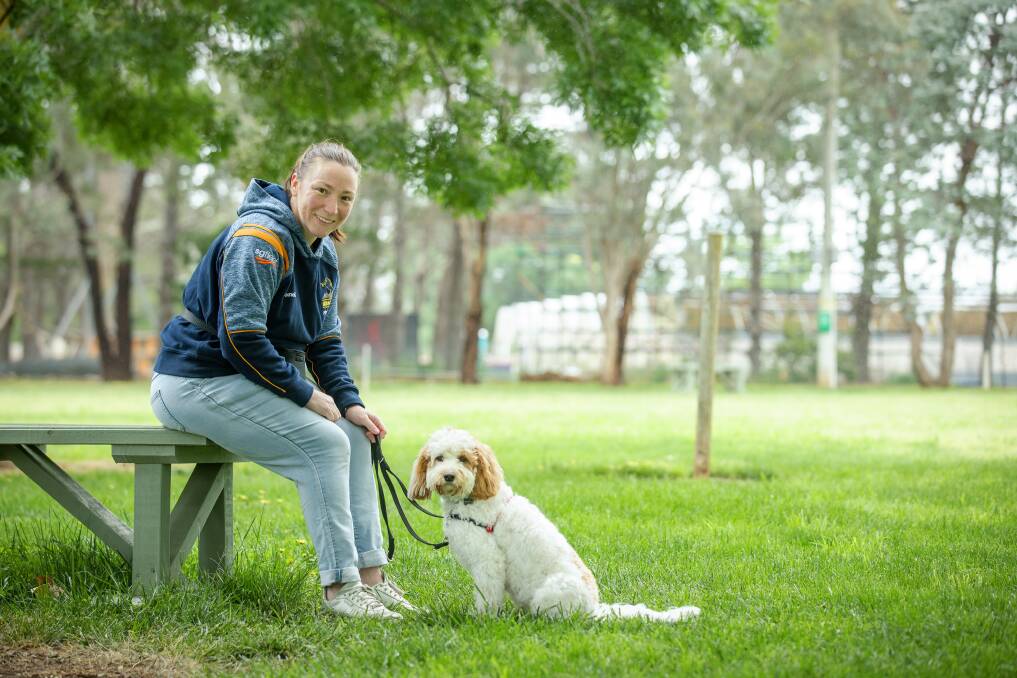 Claire Briant with cavoodle Arlo at the ACT Companion Dog Club. Picture: Sitthixay Ditthavong