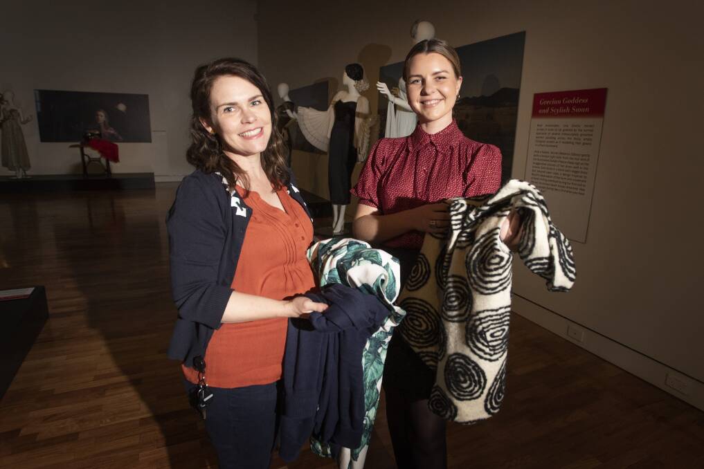 FROCK SWAP: Tamworth Regional Art Gallery staff Kate Armstrong and Eloise Newall. Photo: Peter Hardin 010621PHC010