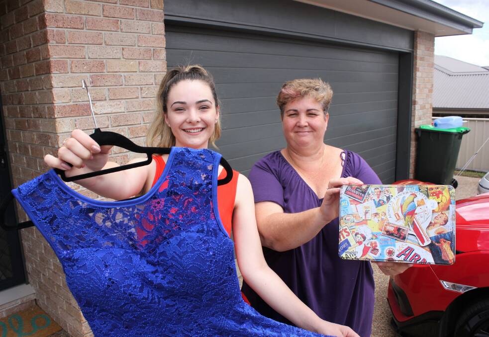 READY TO ROLL: Maddison and Sonya Wren prepare for their garage sale in Calala this weekend.