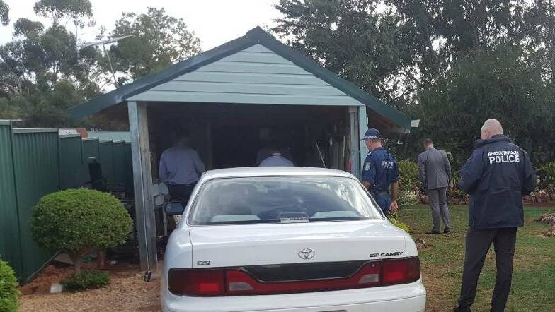 Search warrant: Oxley police at the Baker Street raid in Gunnedah on February 28. Photo: Oxley Police District