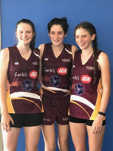 Leading from the front: Emily Burton (vice-captain), Eliza Perkins (captain) and Anna Atkinson (vice-captain) will hold key roles in the NIAS Netball squad this year.