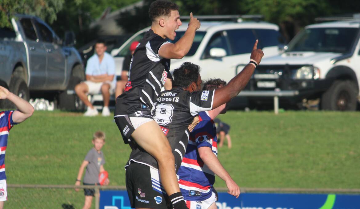Nash Porter jumps on David Murnane's back after another try in their opening round defeat of the Gunnedah Bulldogs. Picture by Zac Lowe.