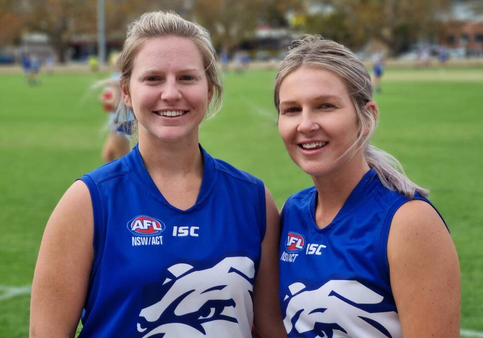 Sisters in arms: Khobi (left) and Braie Devine finally got the chance to play football together for the Gunnedah Poochettes this year. Photo: Zac Lowe.