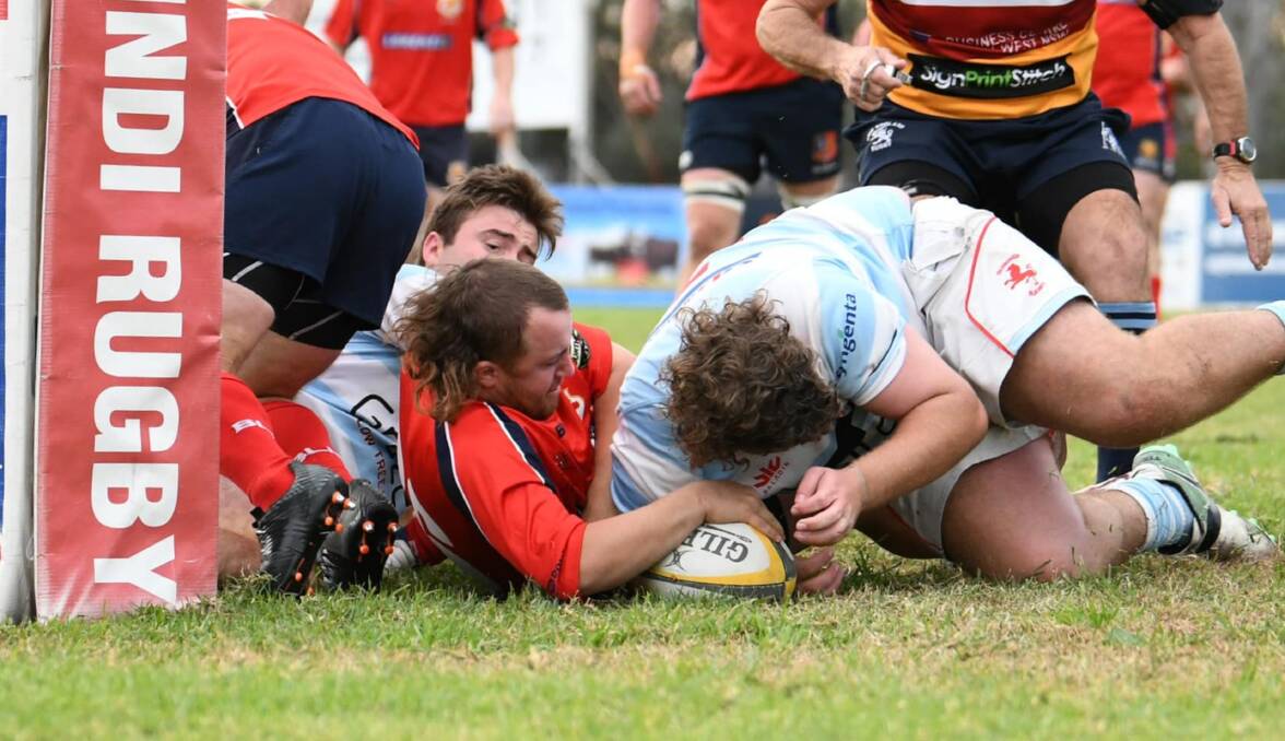 Grounded: Hamish Hockings scores one of Gunnedah's seven tries against the Quirindi Lions last weekend. Photo: Sarah Stewart. 