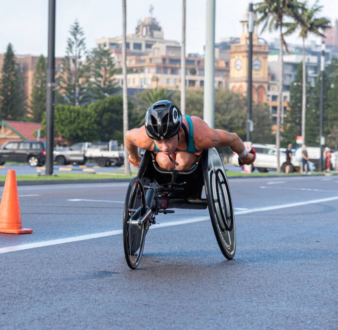 Novocastrian Lauren Parker powers through the course on the way to winning the City of Newcastle Paratriathlon on Saturday. Picture: Lee Pigott