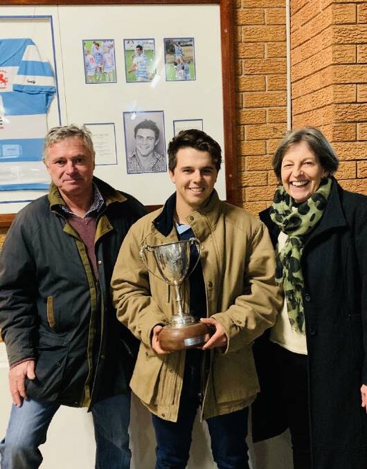 Honoured: Quirindi fullback Lachie Barton receives the Nick Tooth Memorial Trophy from Tooth's parents Graeme and Julie Tooth.