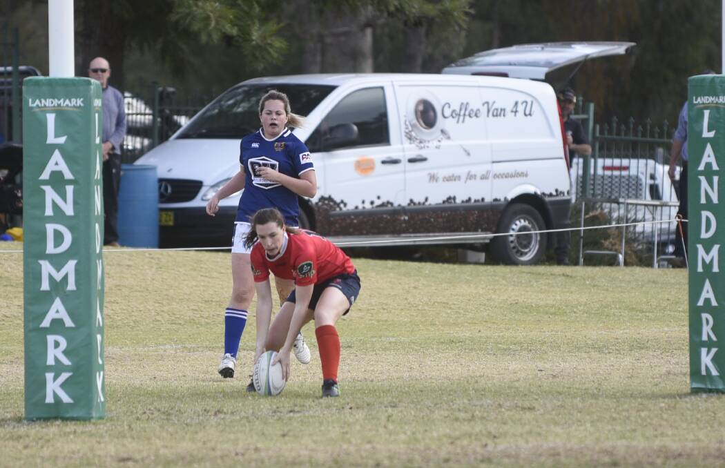 Fiona Laurie dots the ball down for her second try of Game 2.