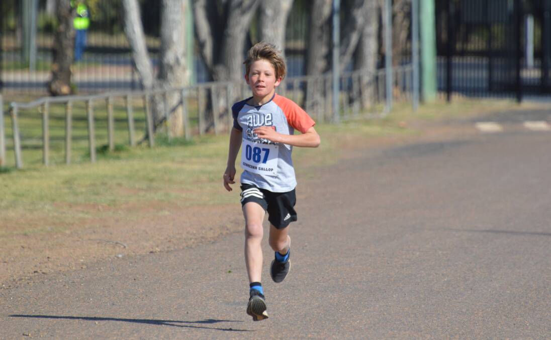 Nash Carlyon strides home to win the 2km race. Photo: Samantha Newsam
