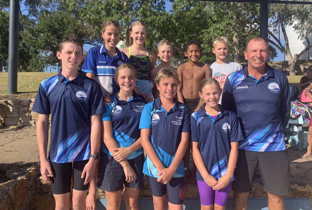 Sydney bound: Coach John Hickey (right) with some of the Swimming Gunnedah crew competing at the NSW Country Championships, which get underway on Friday. 