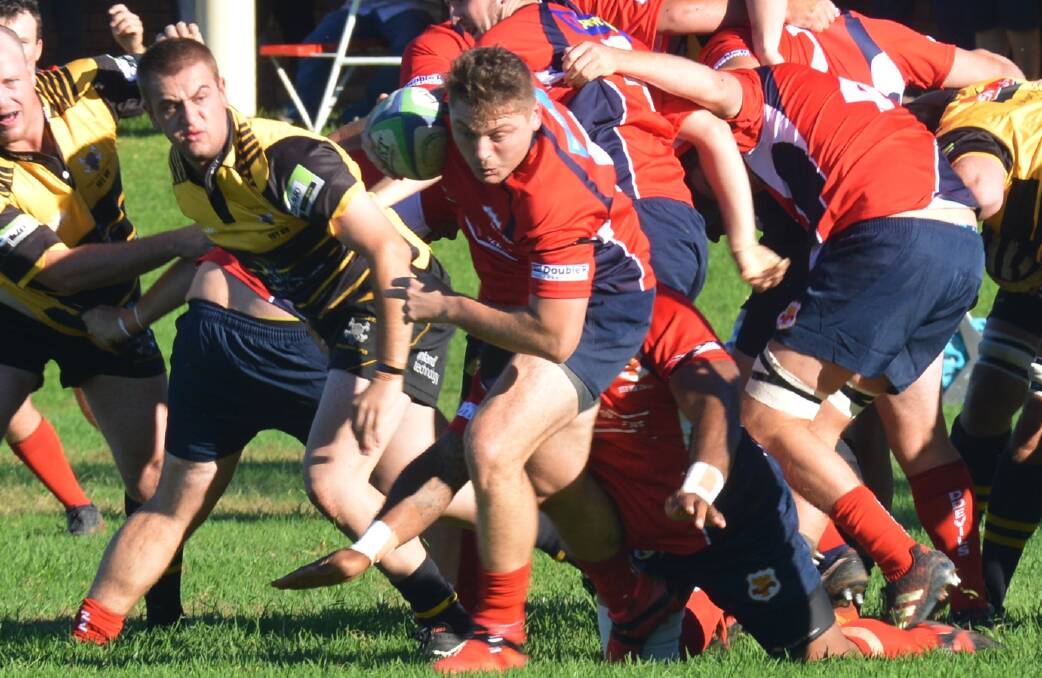 Sniping: Jono Madden finds some space around the ruck during the Red Devils win over Pirates on Saturday.