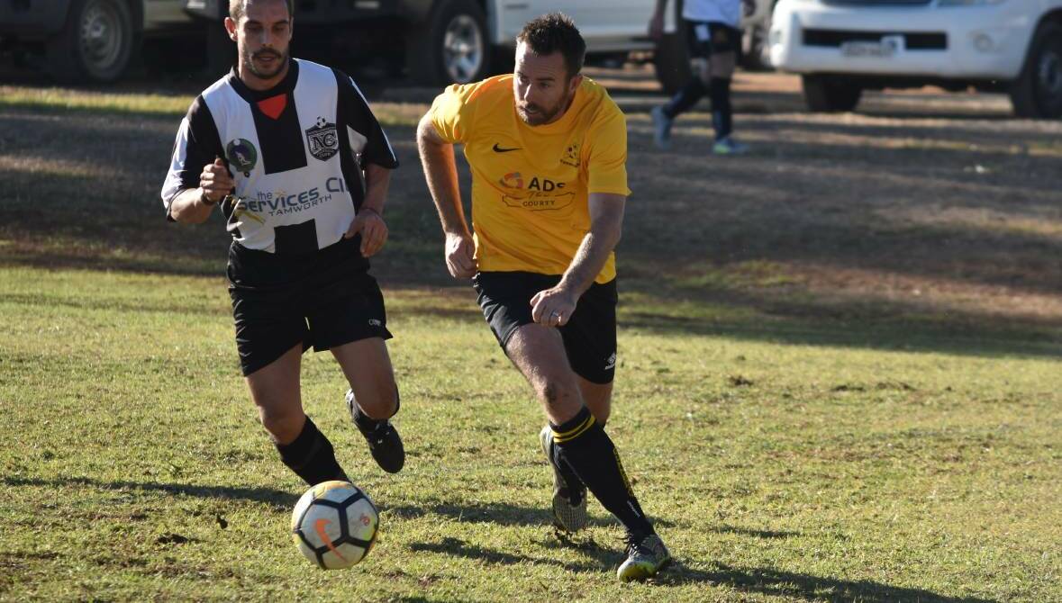 Good test: Gunnedah FC defender Matt Davis, pictured here in action in 2018, says it's great to be back playing in the region's top flight. Photo: Ben Jaffrey 
