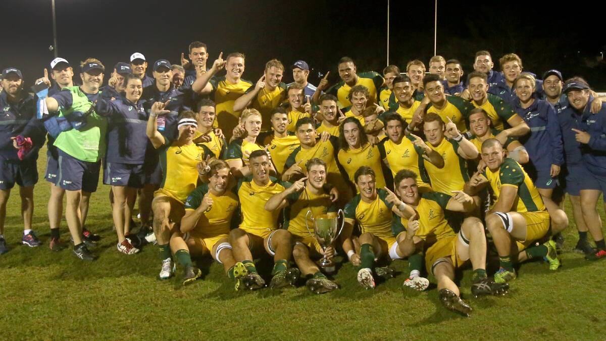 The sweet taste of victory: Bo Abra (second row third from right) and Harry Wilson (back second from left in gold) celebrate their Oceania Championship triumph. Photo: Oceania Rugby/Sportography