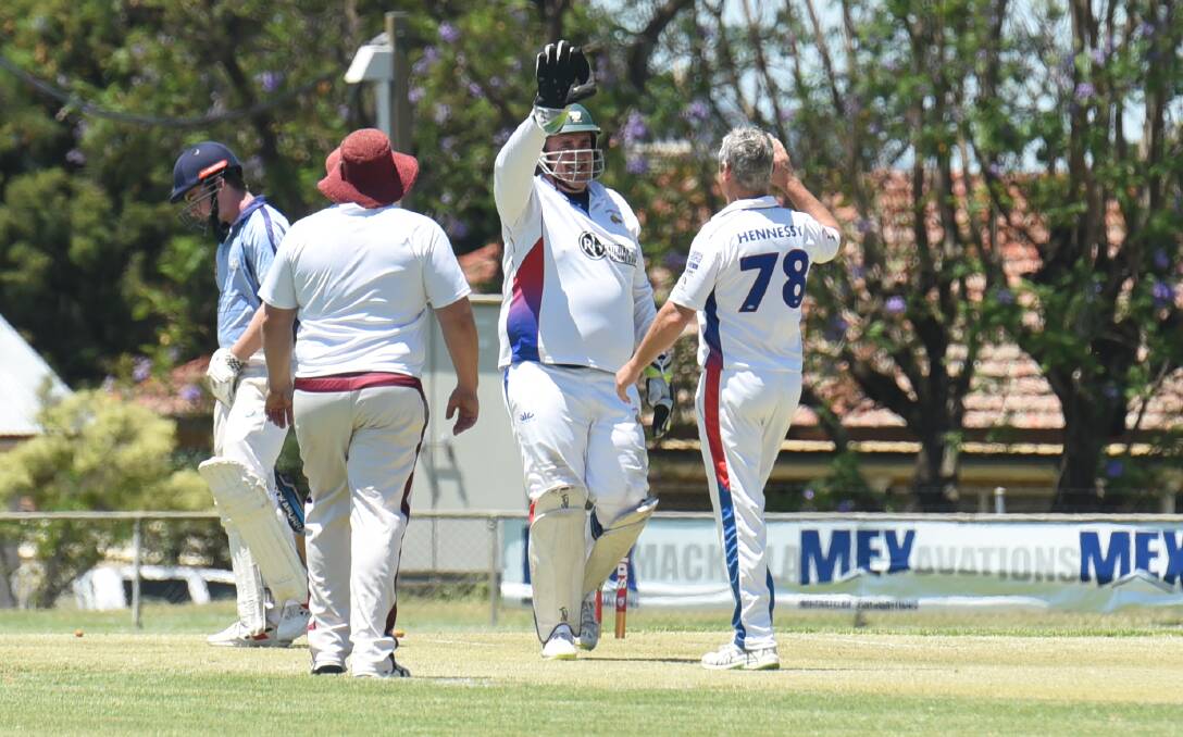 Andrew Johns and Ben Hennessy celebrate another Court House wicket.