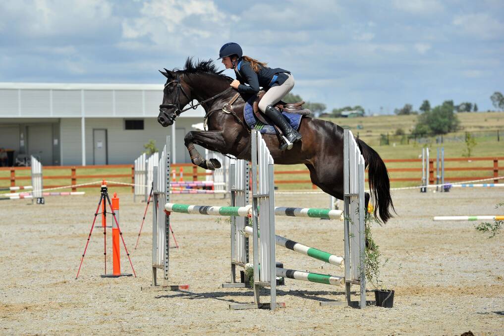 New heights: Molly Baker will compete in the showjumping at this weekend's NSW nationals hub event. Photo: Brie Stranger Photography