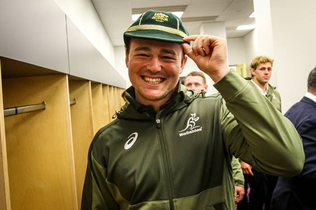 If the cap fits: Harry Wilson proudly shows off his new Wallaby cap after making his debut in Wellington last Sunday. Photo: Andrew Phan/Wallabies Media