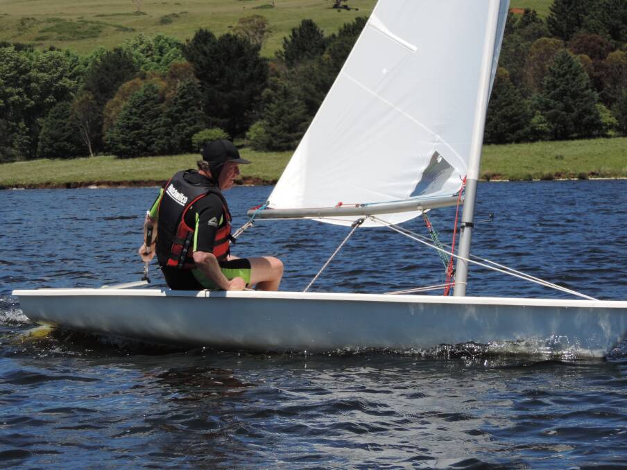 Churning through the water: Keith Garrett displaying the consistent sailing ability that won him the overall honours.