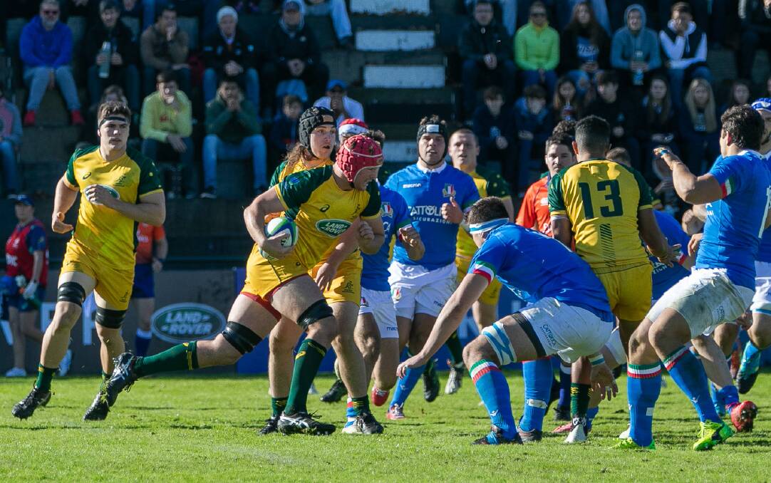 Former Gunnedah junior Harry Wilson charges into the Italian defence. Photo: World Rugby