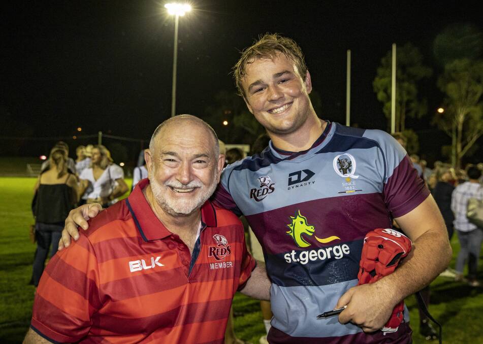 All smiles: Harry Wilson, pictured here with a Reds fan after last weekend's trial in Dalby, will make his Super Rugby debut on Friday night. Photo: Brendan Hertel/QRU Media