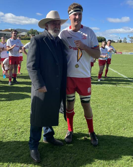 Towering presence: Tim McDermott accepts his player of the Richardson Shield final medal from Tamworth mayor Russell Webb. 