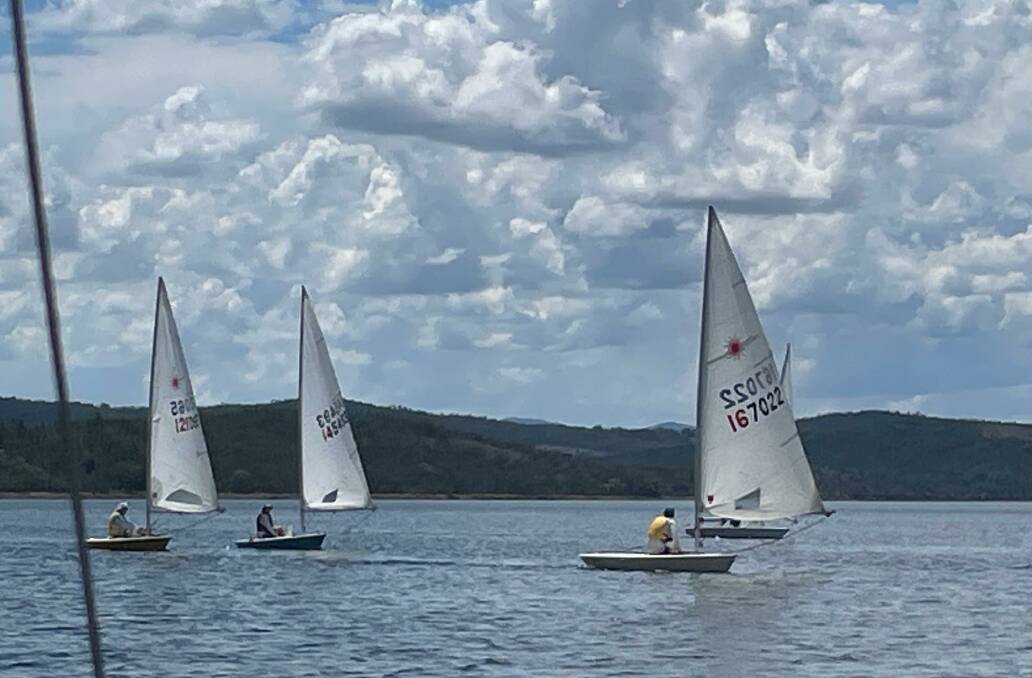 Four laser dinghies about to cross the finish line in Sunday's fourth heat of the club championships with Hugh Evans leading from John Sumner, Tim Corben and Mick Bradfield. Picture Supplied. 