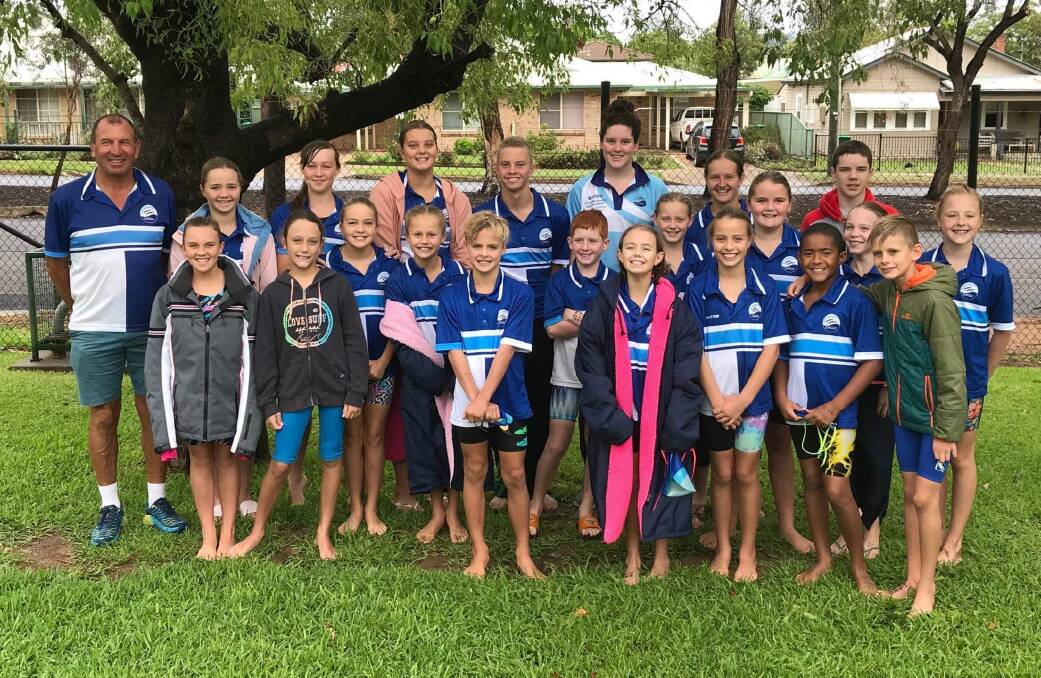 Strong showing: The Swimming Gunnedah squad at area championships with coach John Hickey.