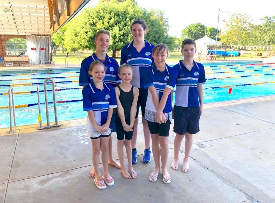 Back in the water: The Gunnedah contingent performed well at the Inverell carnival. Back row: Andre Steele and Maddie Coombs. Front: Georgia Lyons, left, Tahnee Steele, Savannah Lyons and Brodie Coombs. Photo: Lisa Steele.