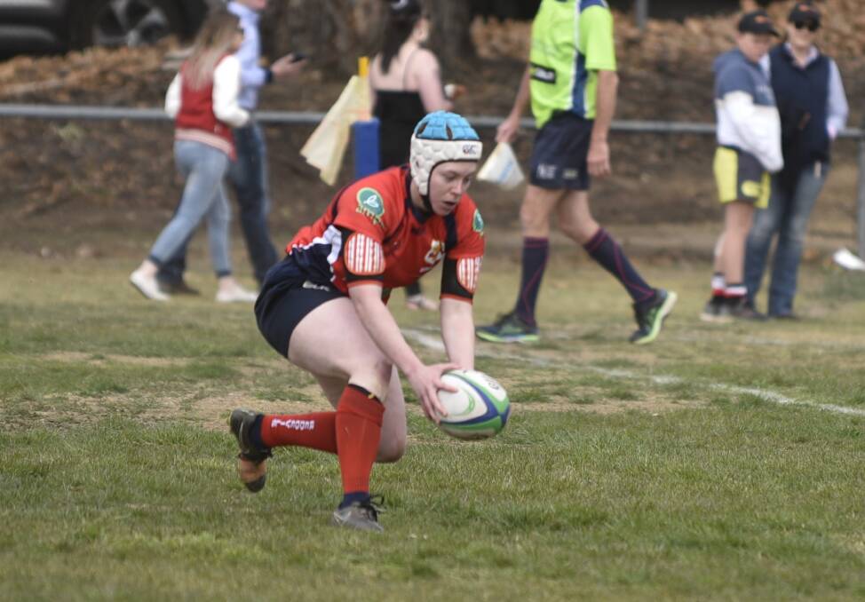 Izzy Hunt puts the ball down for the Red Devils' opening try.