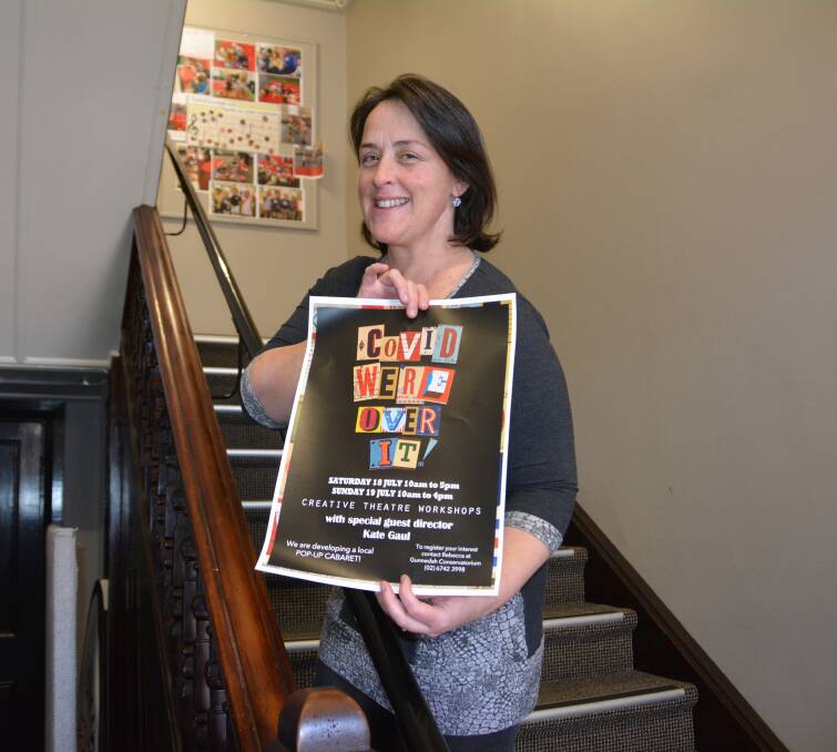 Gunnedah Conservatorium's Rebecca Ryan with the 'Covid - We're Over It' poster.