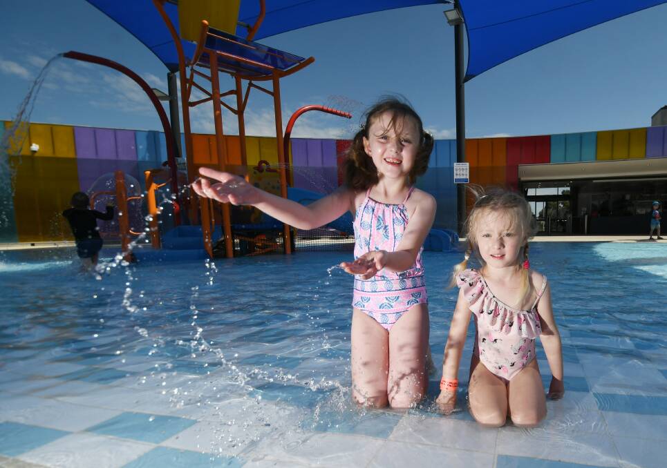 Maddi Blake, 6 and Imogen Blake, 3, at the pool during the school holidays. Photo: Gareth Gardner