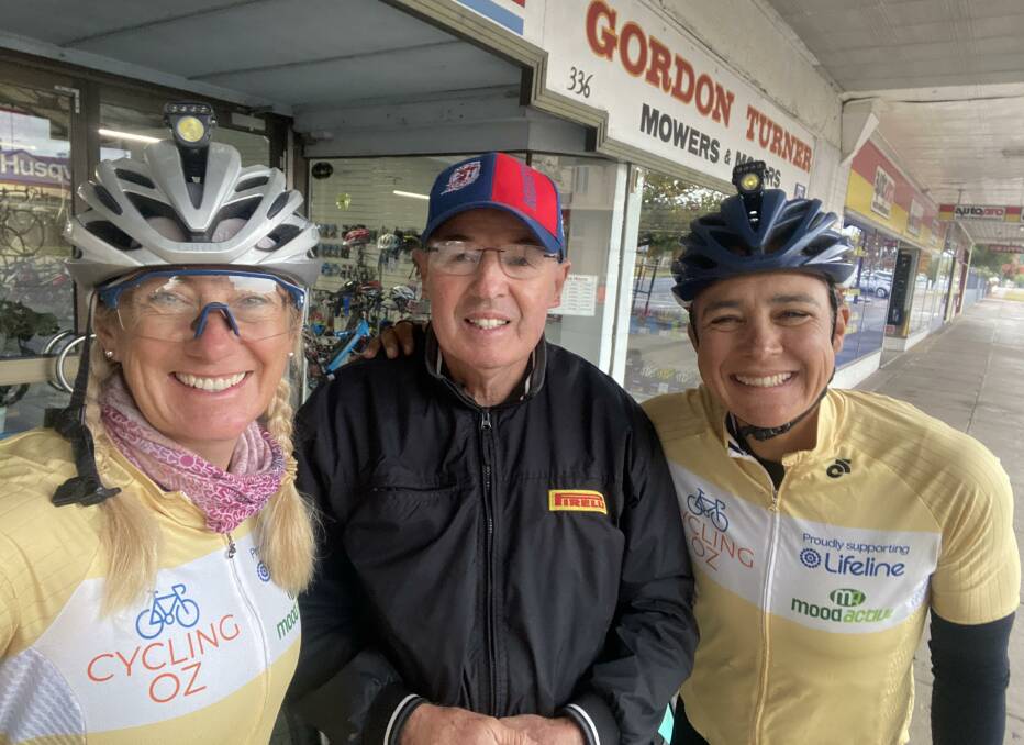 HELPING HAND: Sarah Davis with Garry from Turners Cycles and Tara Lal. Photo: supplied