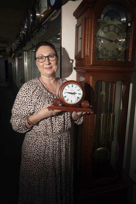TIME TURN: Angie Pennell at Sandy McKinnon Jewellers will be turning the store's clocks back very soon. Photo: Peter Hardin