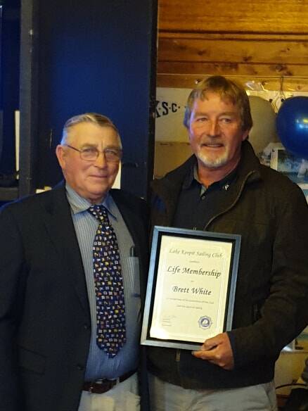 Brett White receives the life membership from club vice commodore Ian Pine. Photo: supplied