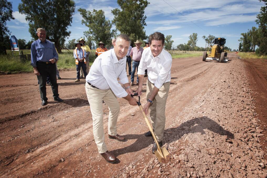 READY TO GO: Gunnedah mayor Jamie Chaffey and Tamworth MP Kevin Anderson turn the sod at Clifton Road. Photo: Peter Hardin