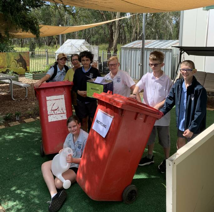 ENVIRONMENT LOVERS: Coonabarabran High School support unit students with learning support officer Vanessa Houley. Photo: supplied