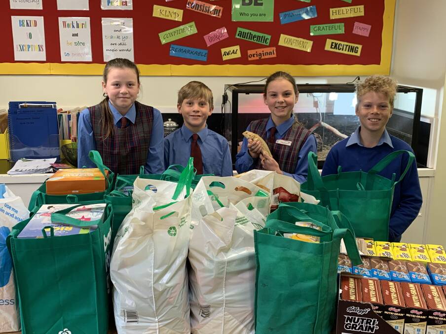 Somerton Public School students Ariella Vallender, Howard MacKenzie, Jacinta Mackenzie and William Hall with some of the donations. Photo: supplied