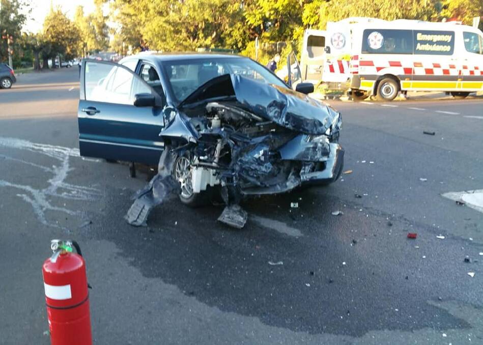 DESTROYED: One of the cars after the crash on Saturday afternoon, in which an elderly woman suffered a broken wrist. Photo: Fire and Rescue NSW Station 314